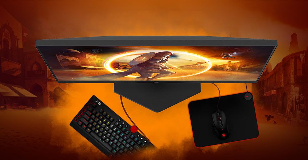 Setup de escritorio gaming con el monitor AOC 24G4XED, mostrando su base compacta que deja amplio espacio para el movimiento del teclado y el ratón