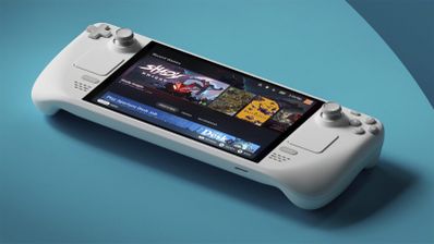 Consola portátil Steam Deck en color blanco sobre una superficie azul mostrando la biblioteca de juegos en pantalla.