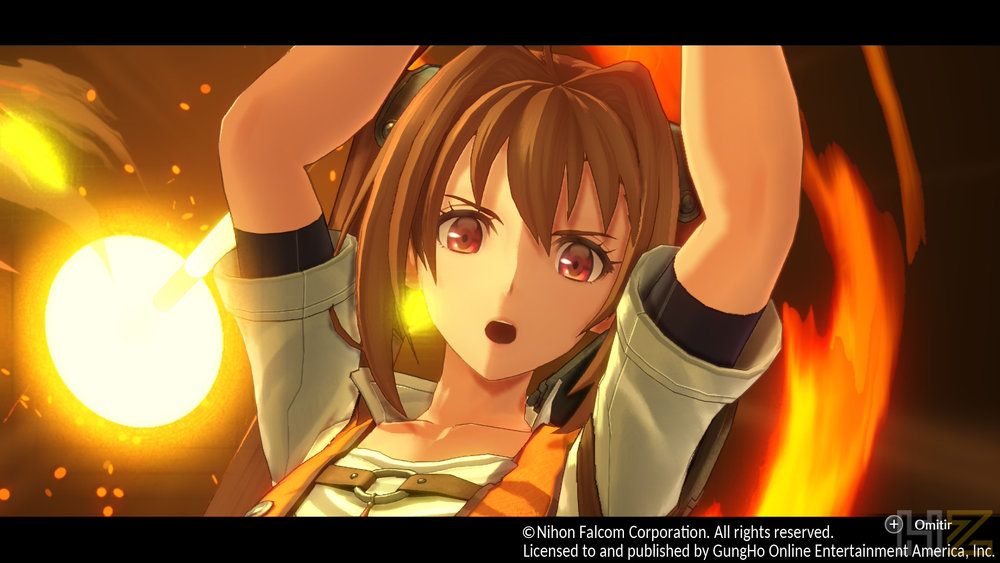 Primer plano de Estelle Bright con expresión de asombro durante una escena de combate con efectos de fuego.