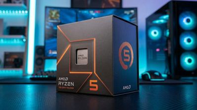 Caja de procesador AMD Ryzen 5 sobre un escritorio en un entorno gaming con iluminación azul.