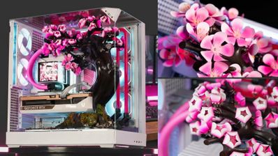 Interior de una caja de PC Cherry Bloom con una réplica de cerezo en flor, refrigeración líquida rosa y tarjeta gráfica GeForce RTX.