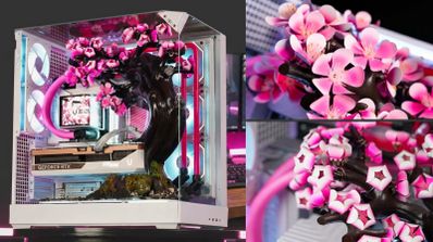 Interior de una caja de PC Cherry Bloom con una réplica de cerezo en flor, refrigeración líquida rosa y tarjeta gráfica GeForce RTX.