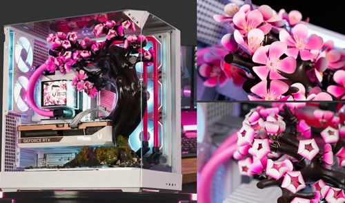 Interior de una caja de PC Cherry Bloom con una réplica de cerezo en flor, refrigeración líquida rosa y tarjeta gráfica GeForce RTX.