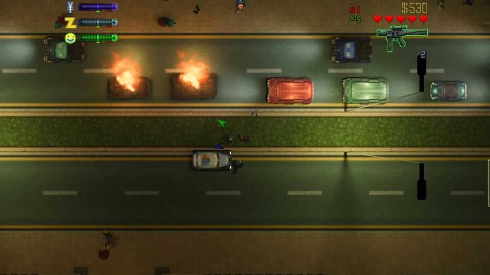 Vista cenital de GTA 2 con iluminación avanzada RTX Remix en una carretera con coches y fuego.