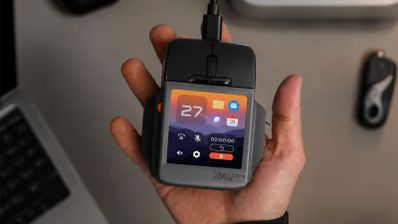Ratón artic fox super mouse con pantalla integrada que muestra iconos de aplicaciones y widgets de sistema.