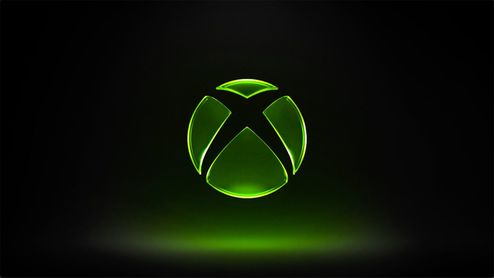 Logotipo de Xbox iluminado en color verde sobre un fondo negro con degradado inferior.