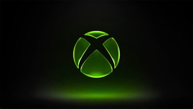 Logotipo de Xbox iluminado en color verde sobre un fondo negro con degradado inferior.