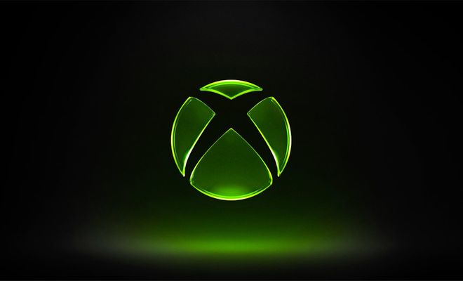 Logotipo de Xbox iluminado en color verde sobre un fondo negro con degradado inferior.