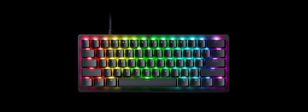 Teclado Razer Huntsman V3 Pro con formato compacto al 60 por ciento e iluminación RGB multicolor sobre fondo negro.