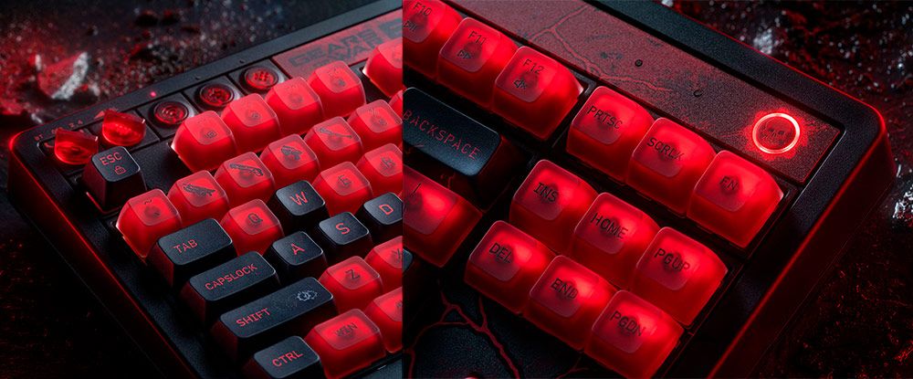 Primer plano de un teclado mecánico 8bitdo con teclas retroiluminadas en color rojo intenso y detalles estéticos de Gears of War: E-Day.